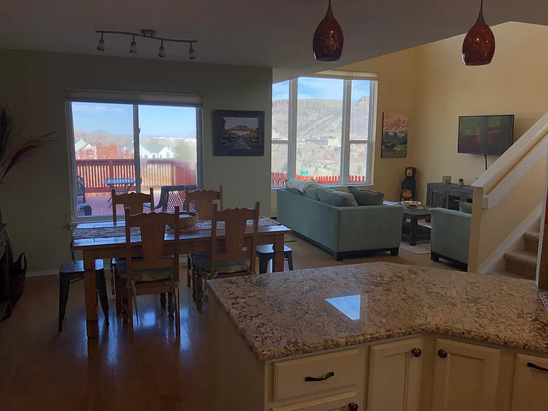 Kitchen looking into dining area and living room