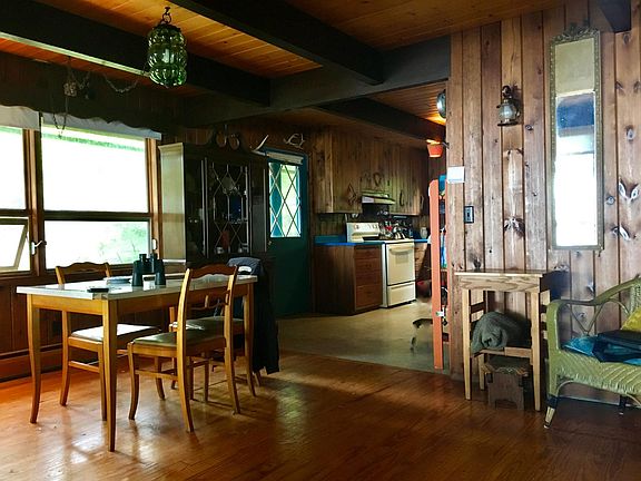 The dining table expands and the kitchen is nearby