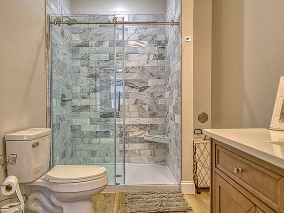Nicely finished bathroom with access through the main area or through the bedroom.