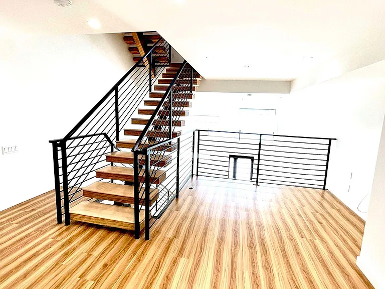 Mezzanine. Flex space overlooking living room. Very functional space perfect for a home office