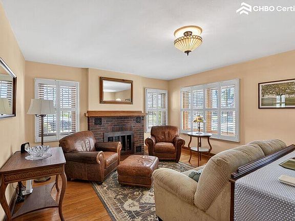 Bright and cozy living room includes gas fireplace.