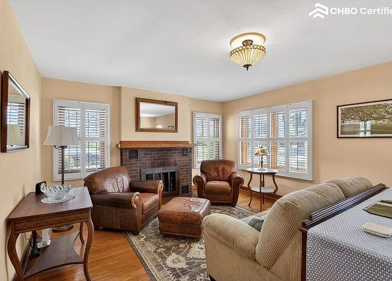 Bright and cozy living room includes gas fireplace.