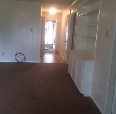 Long view from family room looking toward the front door.