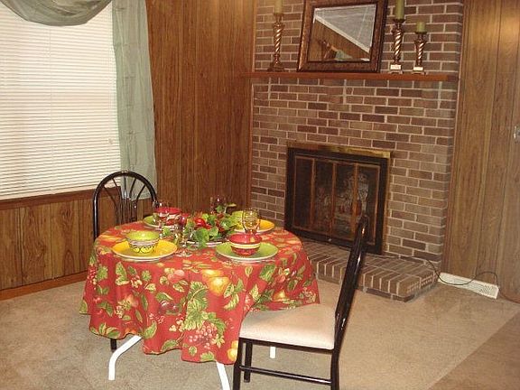 Dining Room or Family Room Wood burning fireplace, large windows 