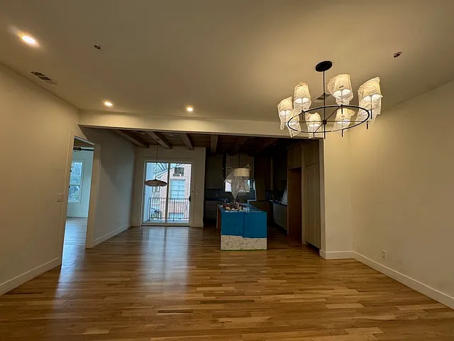 Living room looking into kitchen and dining