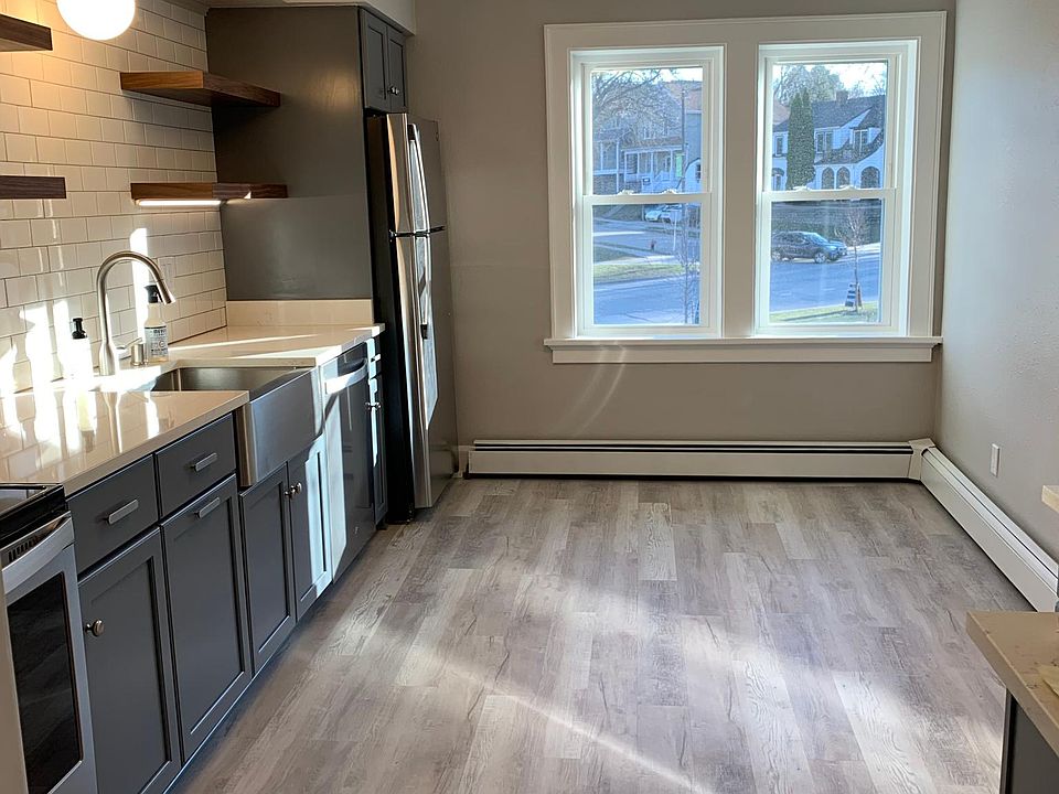 Updated kitchen with brand new stainless steel appliances, farm sink, new cabinets, and quartz countertops.