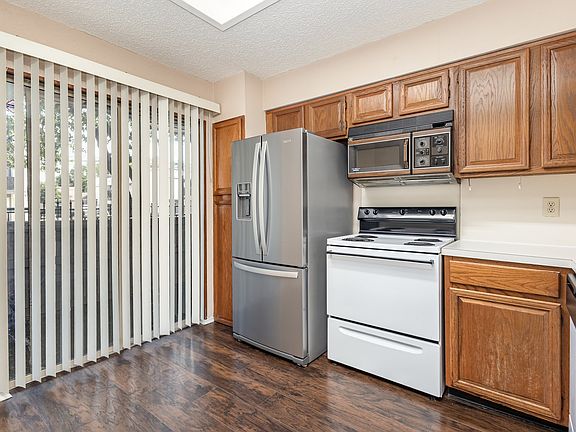 Kitchen with double sided refrigerator, drawer freezer, built in microwave and refrigerator.