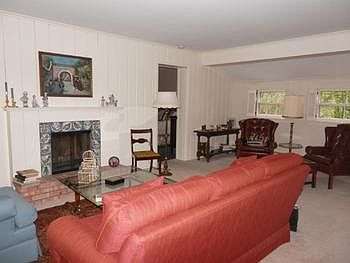 Large oversized living room includes a cozy fireplace for those winter evenings