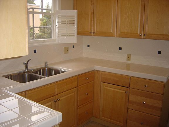 Kitchen Northeast view. Upgraded oven, micro-hood, dishwasher and new refrigerator not shown.