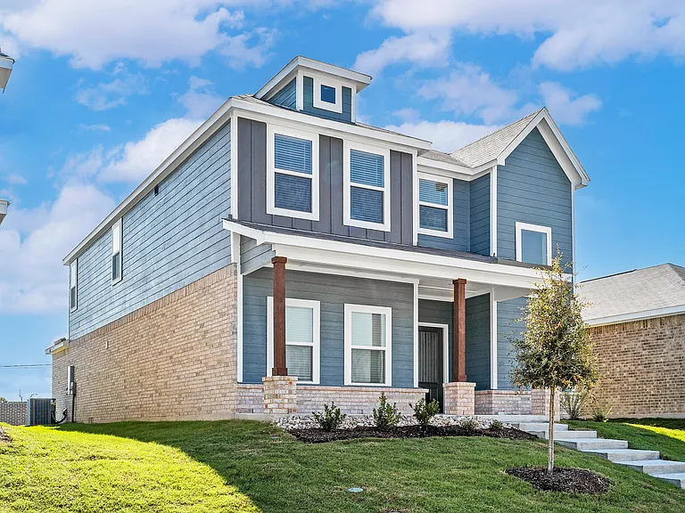 The Azalea has a gorgeous siding exterior with brick details.