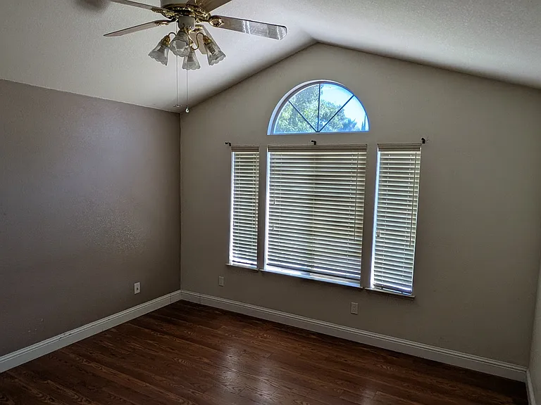 Master Bedroom with window overlooking the driveway