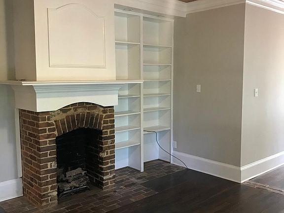 Master bedroom with fireplace, sitting area, and full bath.