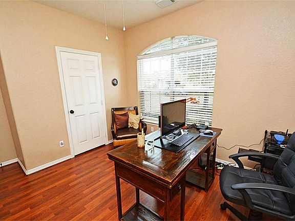 Notice pristine wood floors in study which is located just off the entrance.