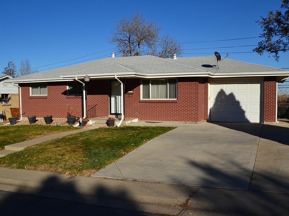 Front exterior with covered porch, 1-car attached garage and extra off-street parking