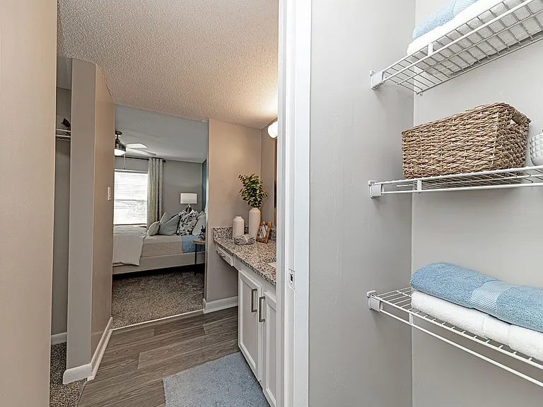 Bathroom with built in shelving for storage