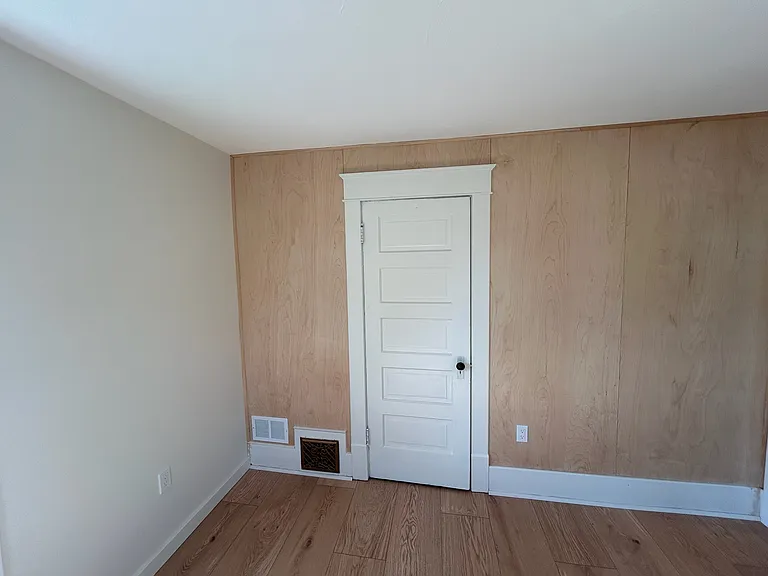 Bedroom and birch wood paneling