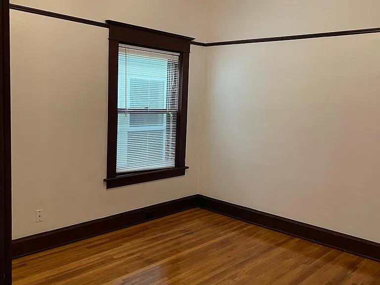 One of two bedrooms. Hardwood floors throughout the apartment.