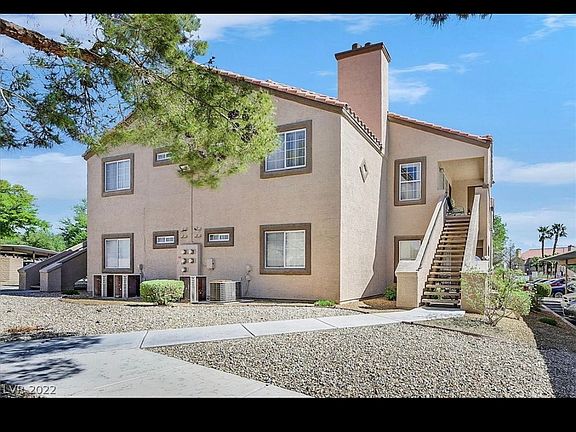 Unit 211 is located on the right side of this photo and up the stairs to the second floor.