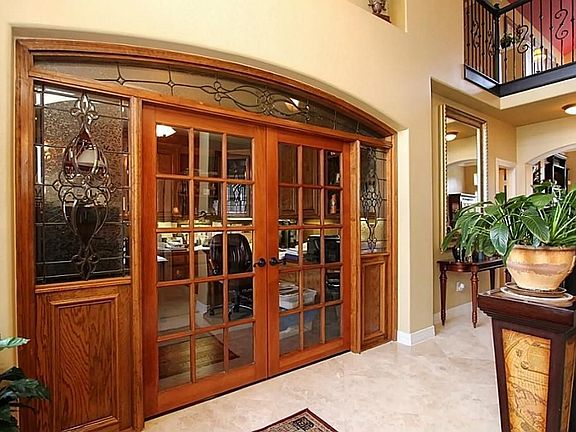 Custom built wood and lead glass  entry to study off entry hall
