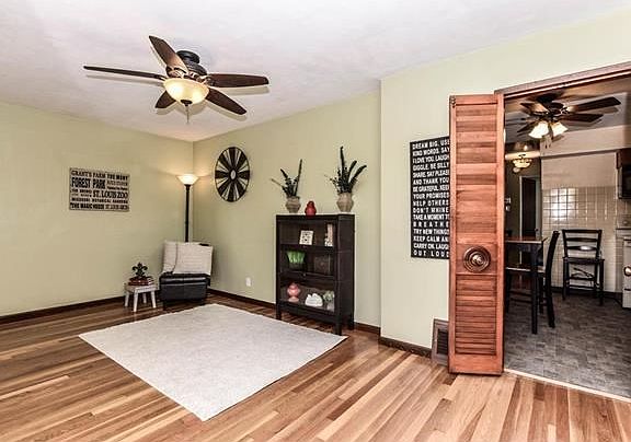 Lovely living room with ceiling fan.