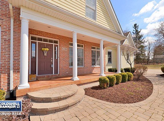 Charming Covered Front Porch with Columns, & Paver Walk-way to Drive. Features Deep Drive Way.