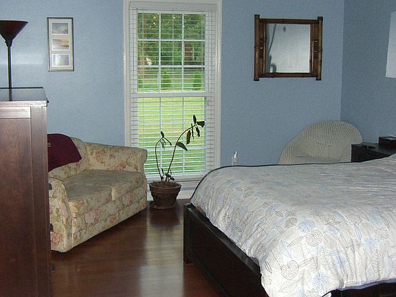 master bedroom with hardwood