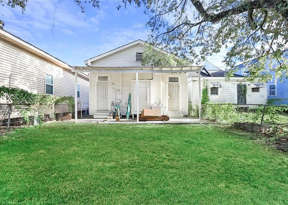 Back yard, view of exterior laundry room
