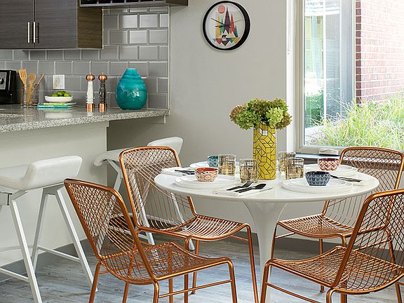 Apartment Dining room with wood floors.