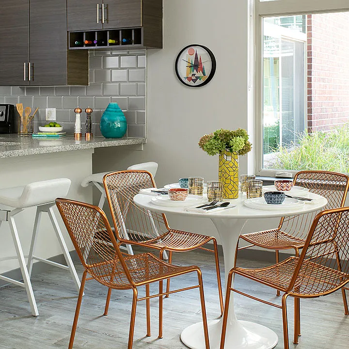 Apartment Dining room with wood floors.