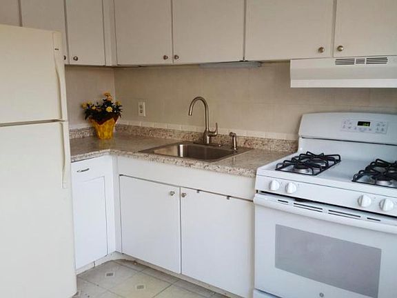 Kitchen with fairly new countertops, sink, and stove