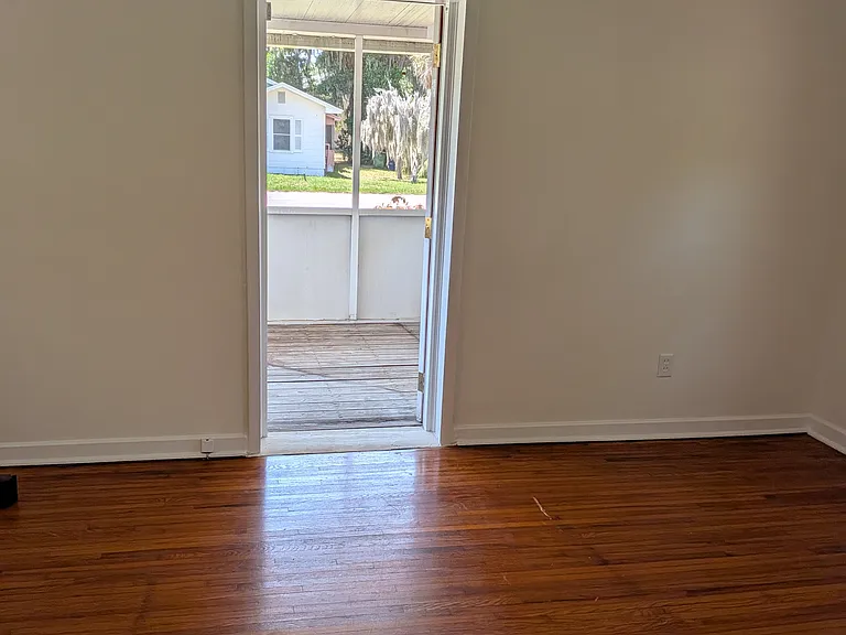 The screened patio off of the bedroom can only be accessed from the bedroom. The patio is raised and it does not have access from the yard.