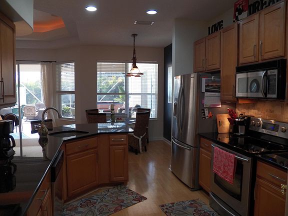 Kitchen Hardwood cabinets with granite
