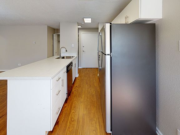 Upgraded stainless steel appliances, quartz countertops, and new cabinets