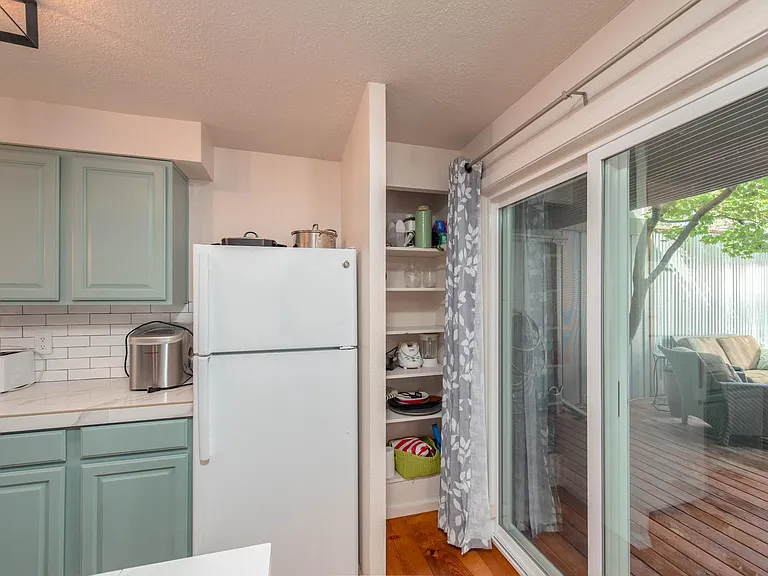 A light and flowing kitchen that leads directly to the deck for entertaining or relaxing.
