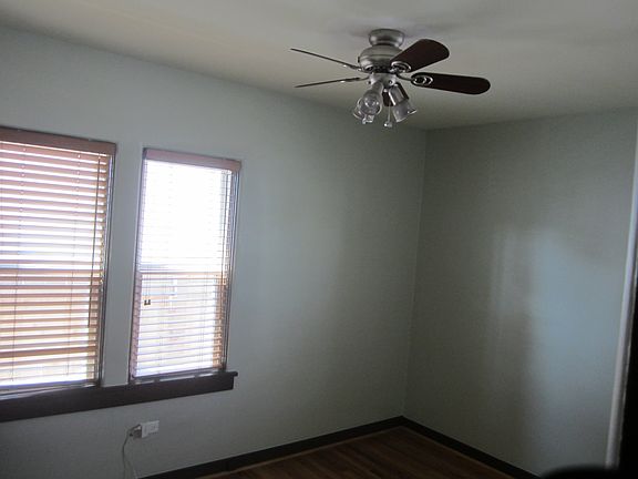 Both bedrooms have two windows and ceiling fans.