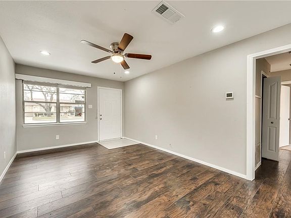 Living area with beautiful updated laminate-wood flooring!