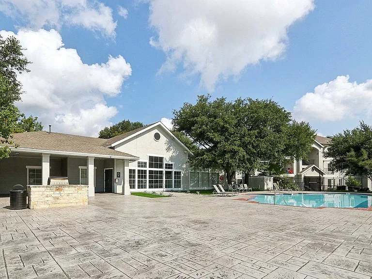 Connect with neighbors at Avonmora's community pool and BBQ area, featuring lounge chairs
