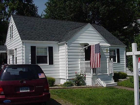 The cute little Cape Style House has Curb Appeal.