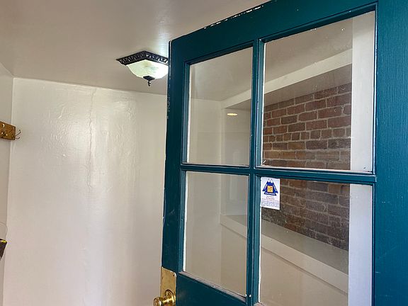 Entering the unit, there is a small foyer with a handy cubby with exposed brick. This is a great place to hang coats, reusable grocery bags, etc...