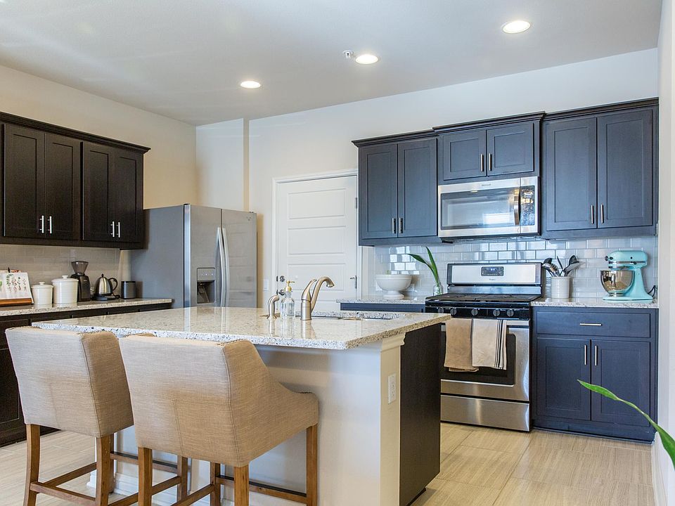 Beautiful modern kitchen with gas range and large refridgerator