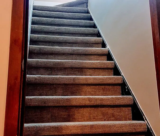 Stairs going up from the 1st floor to the 2nd.