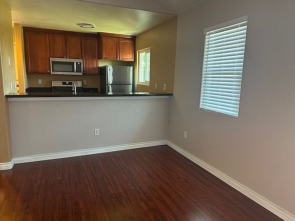 View of kitchen and granite countertop from dinning room.