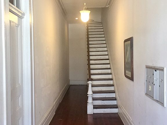 Stairs leading to second-floor unit