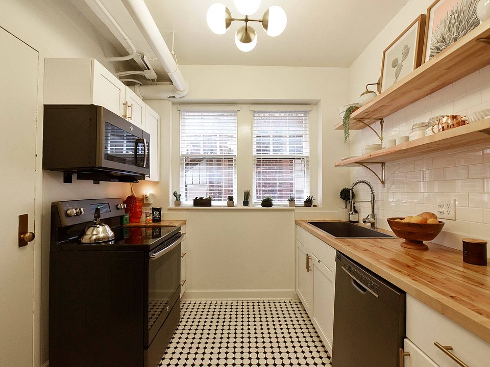 Kitchen with butcher slab counters & custom kitchen shelving