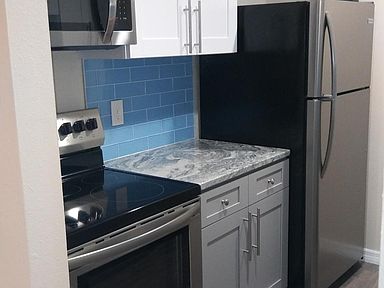 Kitchen has granite counters and stainless steal appliances. Cabinets are stocked with dishes, pots, pans, bake ware, bar ware, and small appliances.