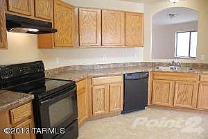 Open Kitchen with Rich Wood Cabinets