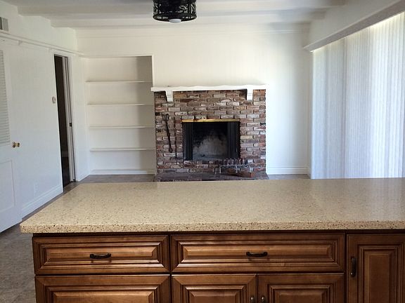 Kitchen/den view, fireplace
