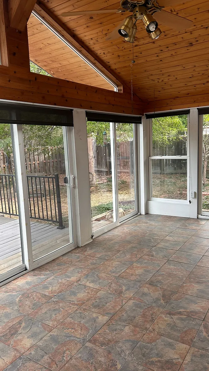 Large sunroom with sliding glass doors and screens. Perfect for plant lovers, yoga, breakfast nook and more - 150 30th St