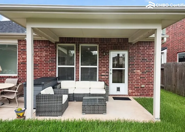 Covered back patio with sitting area