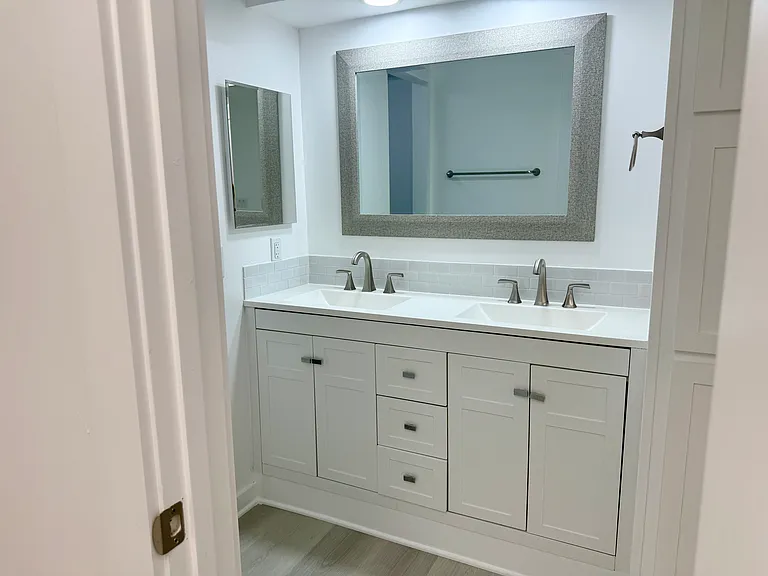 Master bath vanity. Across is walk-in closet